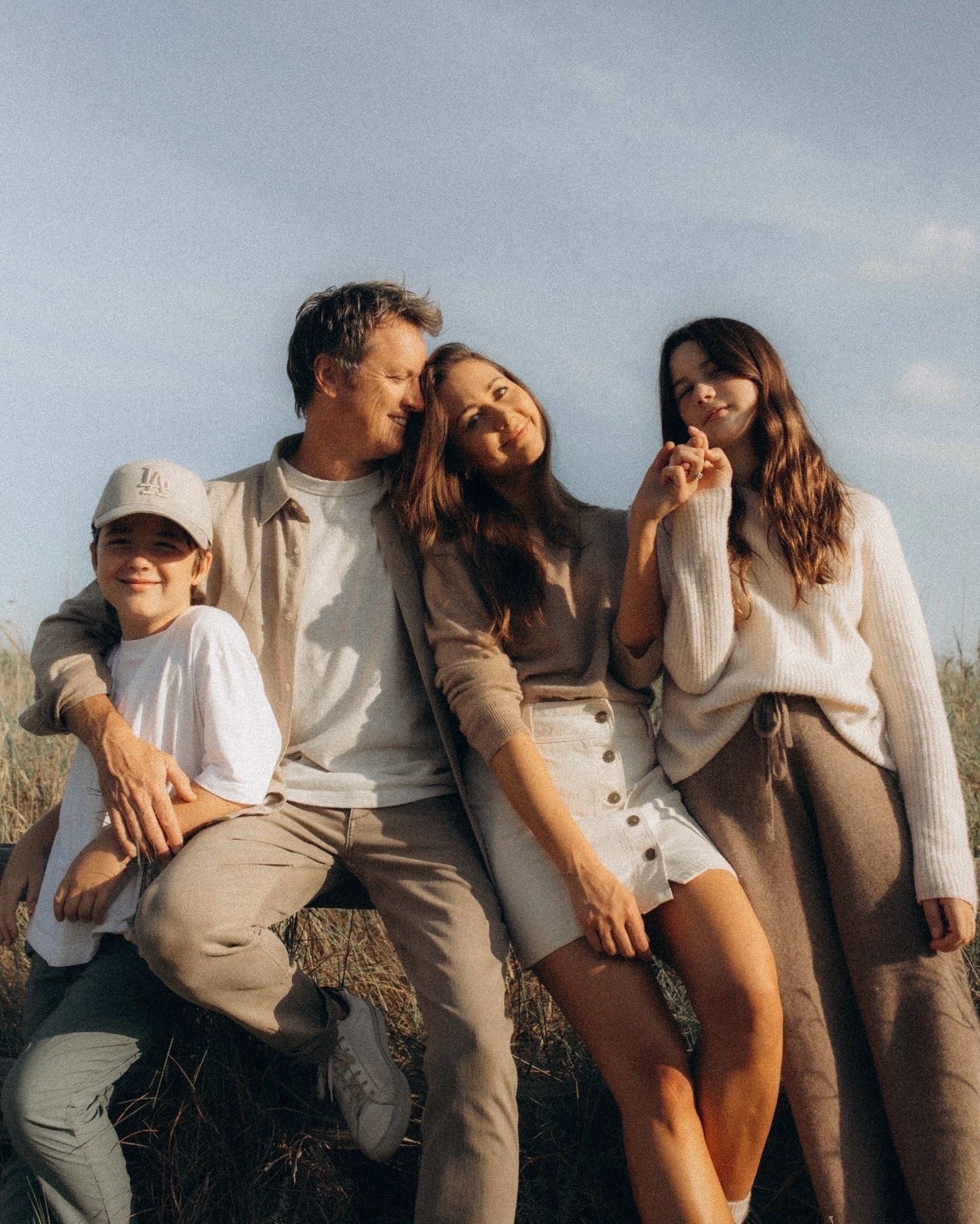 Family sitting together outside